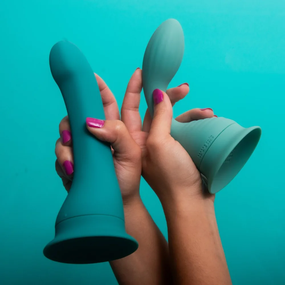 The two ends of The Split double-ended vibrator, held in two hands
